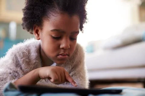 Young Girl Using Digital Tablet At Home Stock Photos