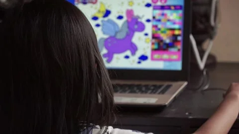 Young girl using laptop computer indoors. Online school, distance learning, and Stock Footage 328797440