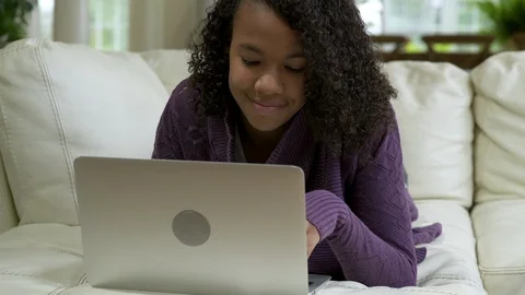Young girl using laptop. 動画素材 88174872