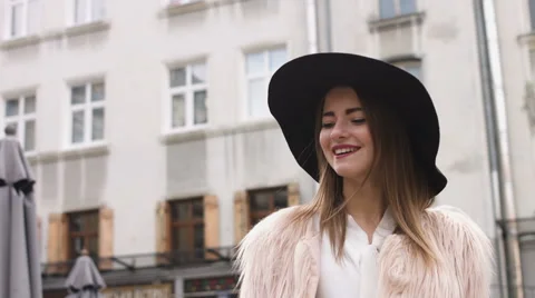 Young girl using mobile phone on the street Stock Footage 67957005