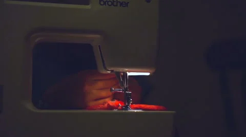 Young Girl Using a Sewing Machine Video stock 64110799