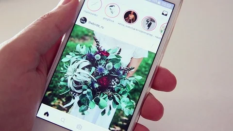 Young Girl Using Smartphone For Checking Instagram Video stock 79274115