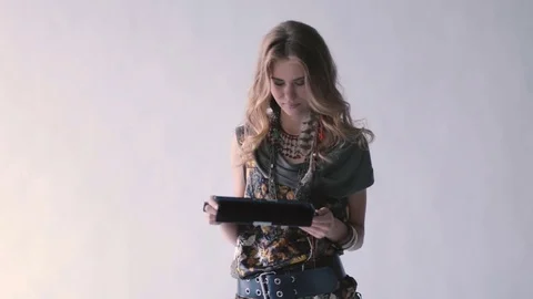 Young girl using a tablet PC and smiling Stock Footage 70311398