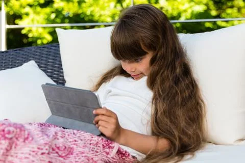 Young girl using tablet Stock Photos