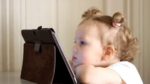 Young girl using touchscreen tablet technology Stock-Footage 77347607