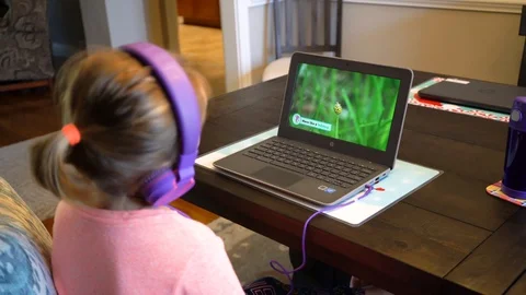 Young girl virtual learning on laptop Stock Footage 127590983