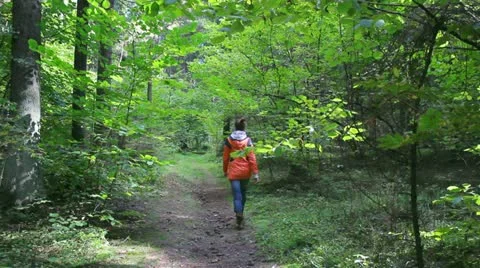 Young  girl walking in the forest Stockbeeldmateriaal 12046504