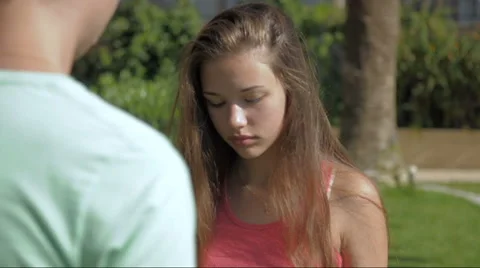 Young girl walking under an umbrella Video stock 64475813