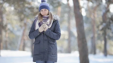 Young girl walking in the winter woods Stock Footage 59658162