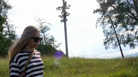 Young girl walks down the path Stock-Footage 80267026