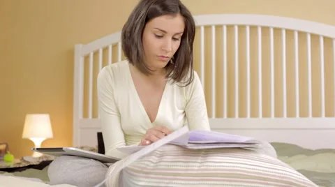 Young girl working at the bed Stock Footage 62519112