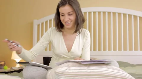 Young girl working at the bed Stock Footage 62519142