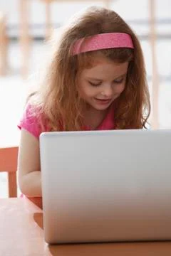Young girl working on computer Stock Photos