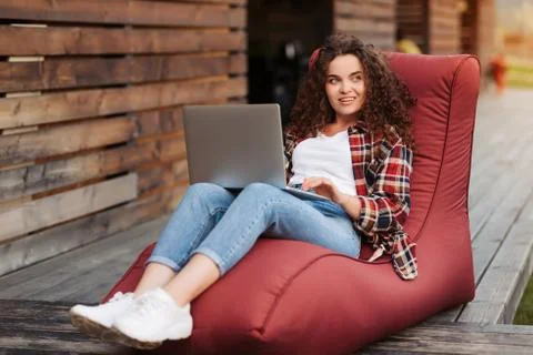 Young girl working at the computer while lying down, online learning Stock Illustration