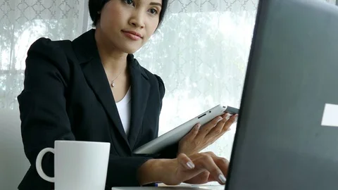 Young girl working by using computer Stock Footage 76823271