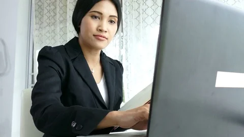 Young girl working by using computer Stock Footage 76997187