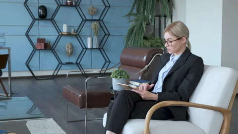 Young girl works on the tablet on the internet, holding tablet in hand Stock Footage 130871053