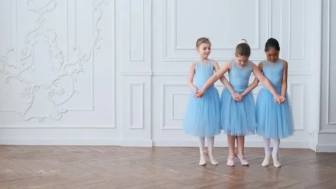 Young girls from ballet dancing ballet in white studio. Pretty graceful Stock Footage 195866331