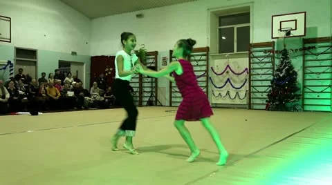 Young girls gymnasts at the New Year's performance in school of gymnastics Stock Footage