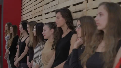 Young girls lined up in a row for the selection of the casting Stock Footage 46377761