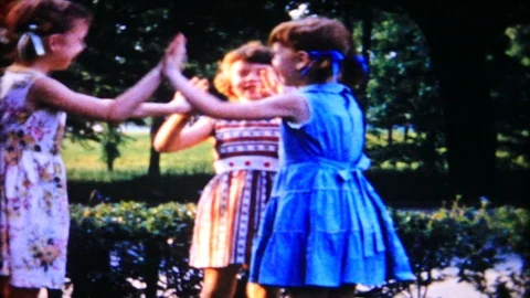 Young girls play hand clapping game 1950s vintage film home movie 5040 Stock Footage