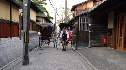 Young girls sitting on the pulled rickshaw Stock Footage 97631330