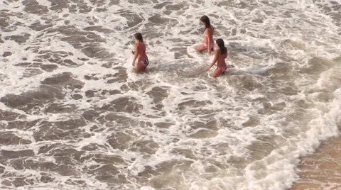 Young girls while bathing in the sea Stock Footage 32595819