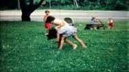 Young Girls Wrestle On The Grass In Frontyard 1950S Family Home Movie 6027 Stock Footage