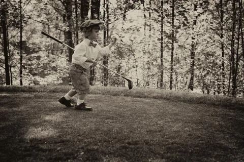 Young golfer on golf course Stock Photos