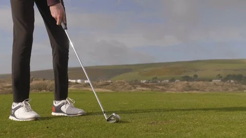 Young Golfer striking ball Stock Footage 104564133