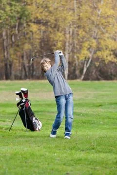 Young golfer swing Stock Photos