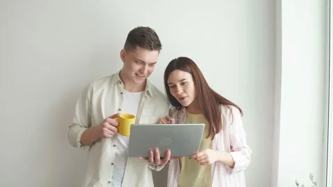 Young good looking programmer fixing woman's computer. Stock Footage 125664050