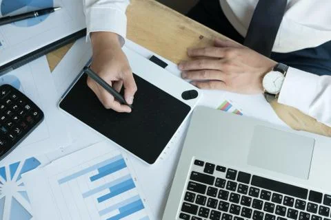 Young graphic designer working with computer. creative man using digital tabl Stock Photos