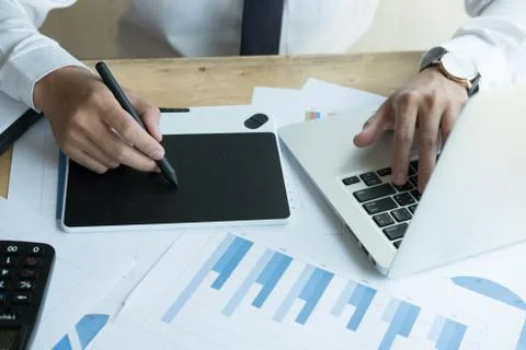 Young graphic designer working with computer. creative man using digital tabl Foto stock