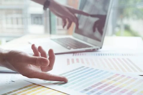 Young graphic designer working with computer, color swatch. creative man usin Foto stock