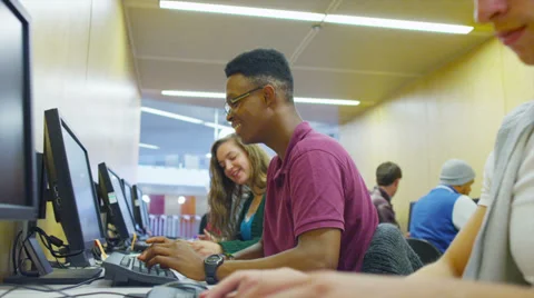 Young group of college students working in a computer class Stock Footage
