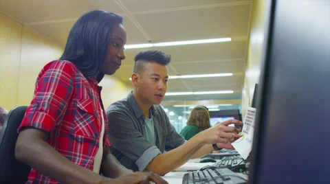 Young group of college students working in a computer class Stock Footage