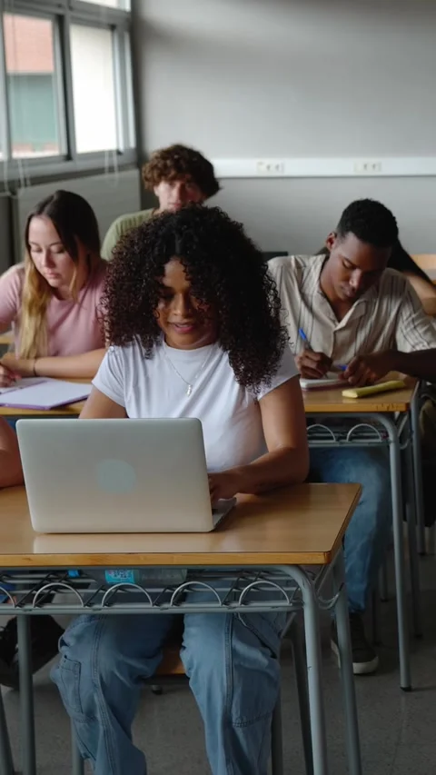Young group of diverse students studying at high school classroom Stock Footage 310780340