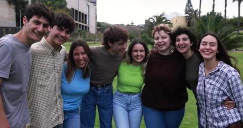 Young group of friends having fun outdoor with university on background Stock Footage 203724395