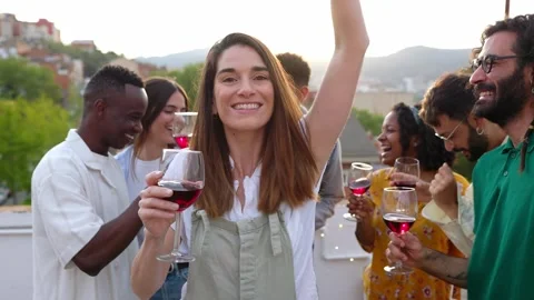 Young group of friends having fun dancing at rooftop dinner party. Stock Footage 249905346