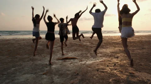 Young group happy jumping on the beach. Stock Footage 177976426