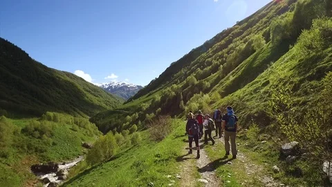 Young group hiking and chatting in the Georgian mountains. Stock Footage