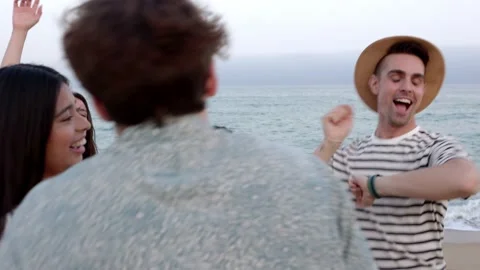 Young group of multiracial friends dancing at beach party in summer holiday Stock Footage 201600610