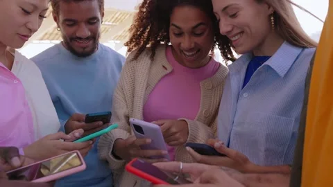 Young group of multiracial friends having fun using mobile phones Stock Footage 268611725