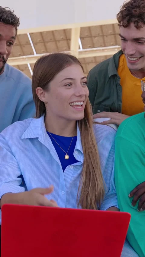 Young group of multiracial students working together on laptop outdoors. Stock Footage 312200187