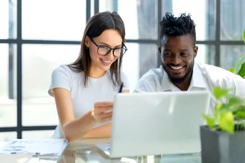 Young group of people doing their jobs on laptop Stock Photos