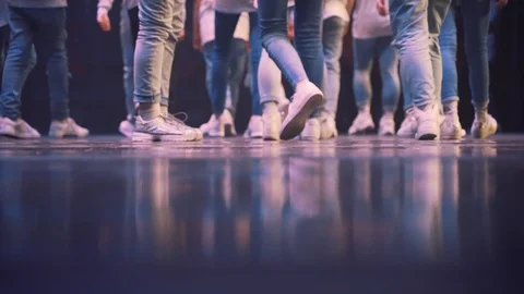 Young group of performers walk of the stage Stock Footage 122166312