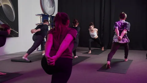 A young group stretching with the help of a hands locked behind the back Stock Footage 156243773