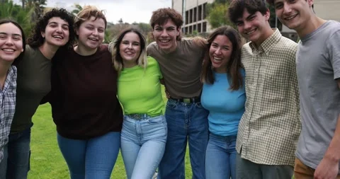 Young group of students friends having fun outdoor with university in background Stock Footage 203723342