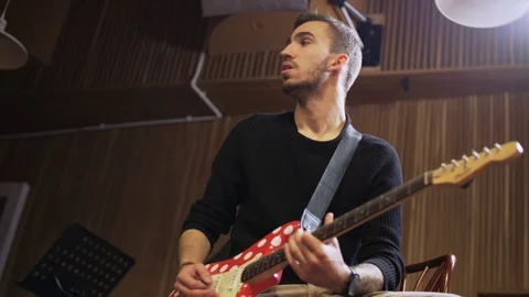 Young Guitar Player Angry With His Colleague Stock Footage 72193067